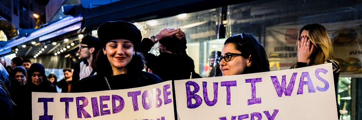 Signs read: "I tried to be a joyful feminist... but I was very angry" at demo in Turkey