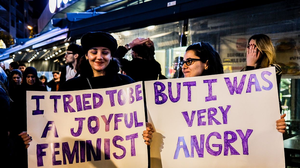 Signs read: "I tried to be a joyful feminist... but I was very angry" at demo in Turkey