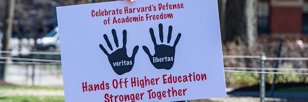 Signs says: "Celebrate Harvard's Defense of Adademic Freedom"