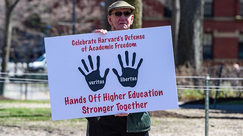 Signs says: "Celebrate Harvard's Defense of Adademic Freedom"