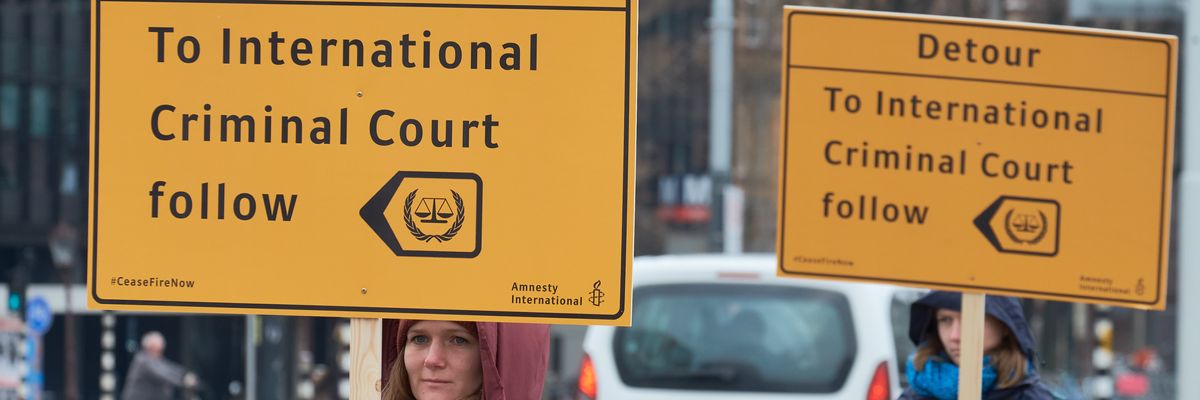 Signs says "Detour: To the International Criminal Court follow"