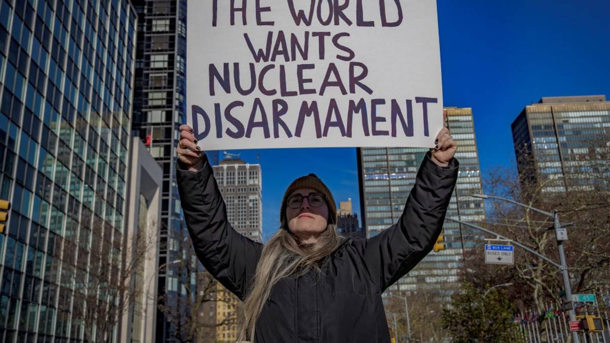 Signs says "The World Wants Nuclear Disarmament"
