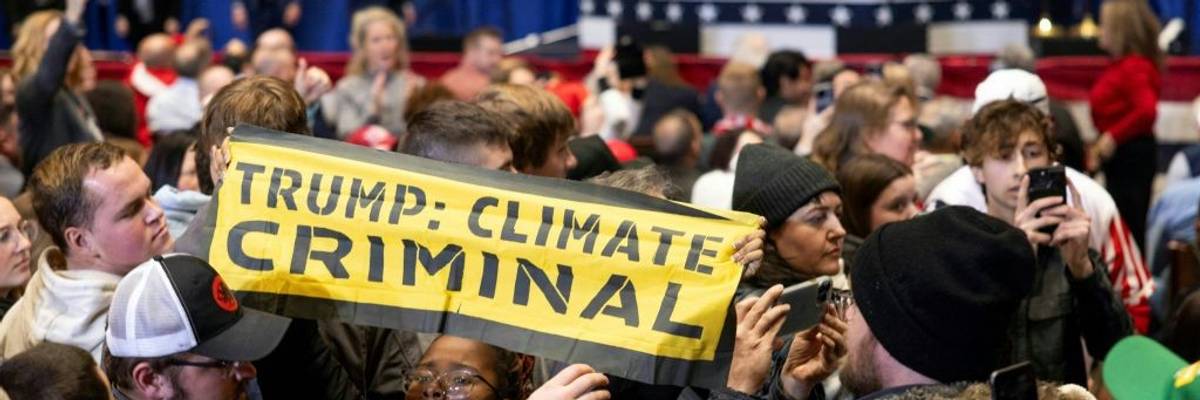 Signs says "Trump:Climate Criminal"