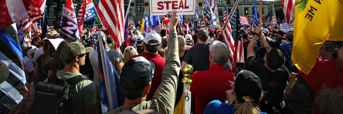 Signs that says "Stop the Steal" at a pro-Trump rally 
