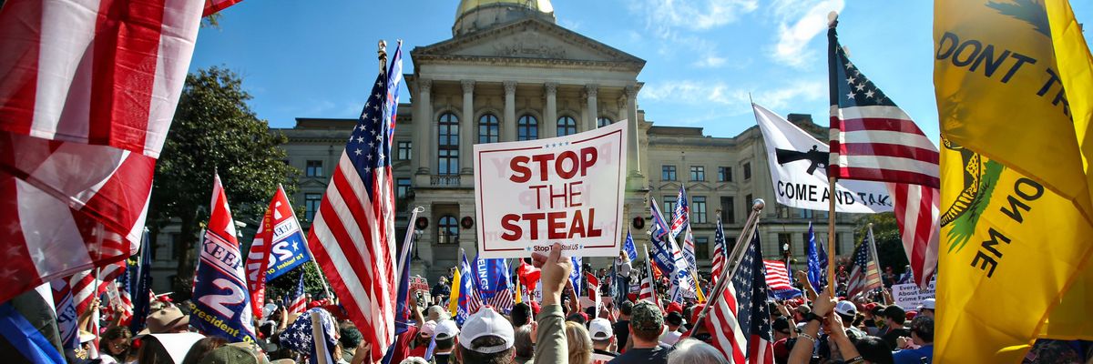 Signs that says "Stop the Steal" at a pro-Trump rally.