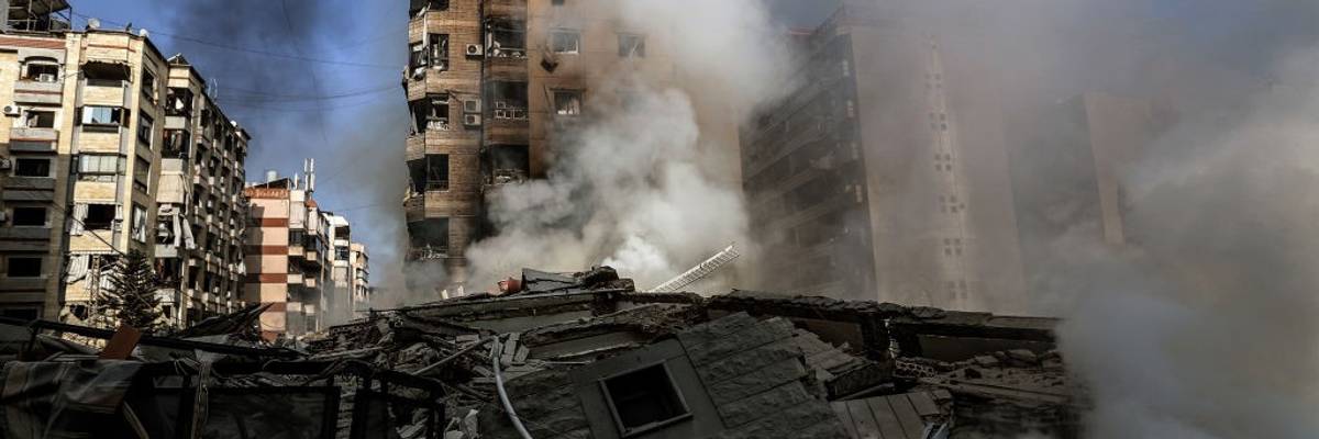 Smoke billows from buildings targeted by Israeli air raids
