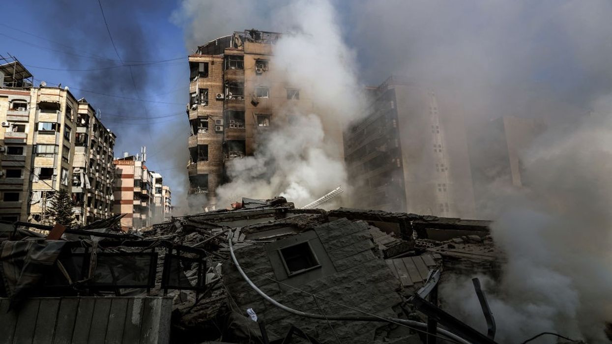 Smoke billows from buildings targeted by Israeli air raids