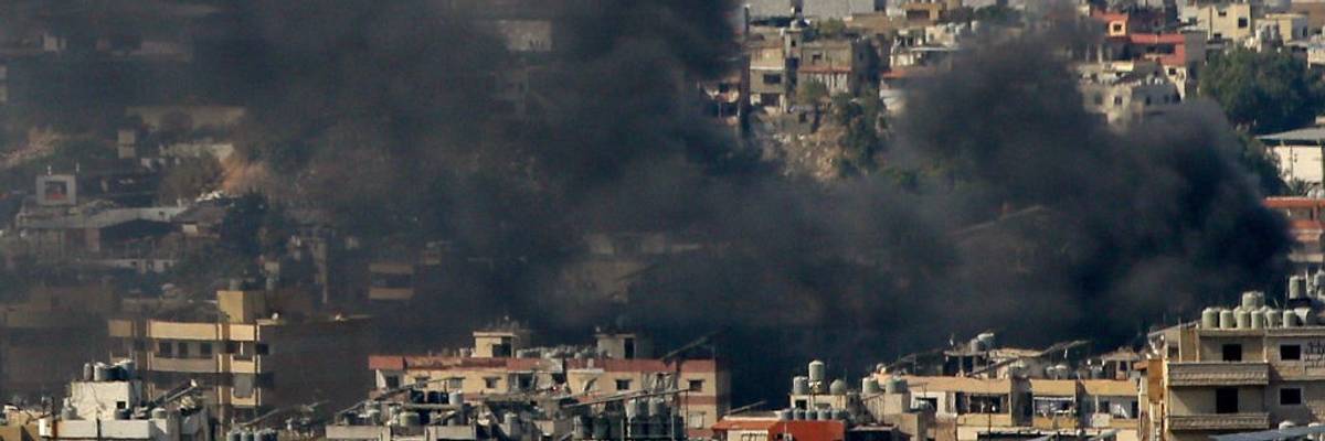 Smoke from Israeli air raid in a Beirut suburb
