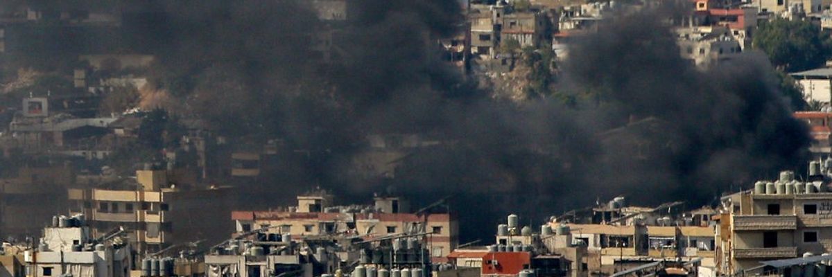 Smoke from Israeli air raid in a Beirut suburb