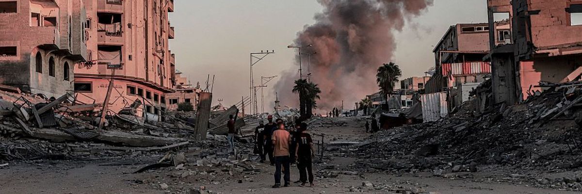 Smoke rises after Israeli strikes hit the Islamic University area in Gaza City,