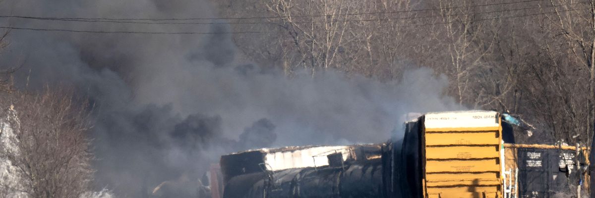 Smoke rises from a derailed cargo train in East Palestine, Ohio on February 4, 2023.