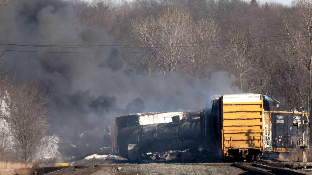 Smoke rises from a derailed cargo train in East Palestine, Ohio on February 4, 2023.