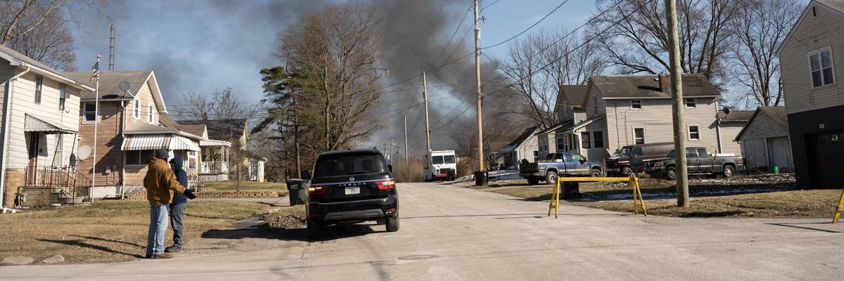 Smoke rises from a derailed cargo train in East Palestine, Ohio
