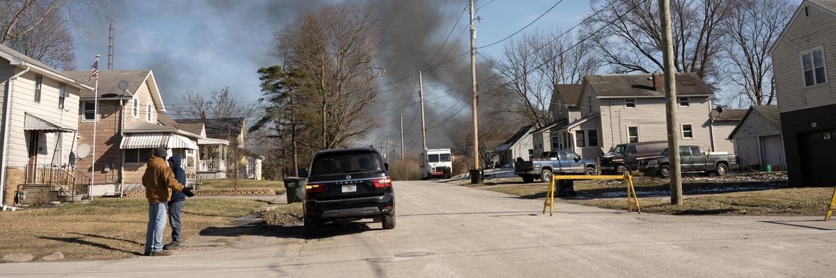 Smoke rises from a derailed cargo train in East Palestine, Ohio