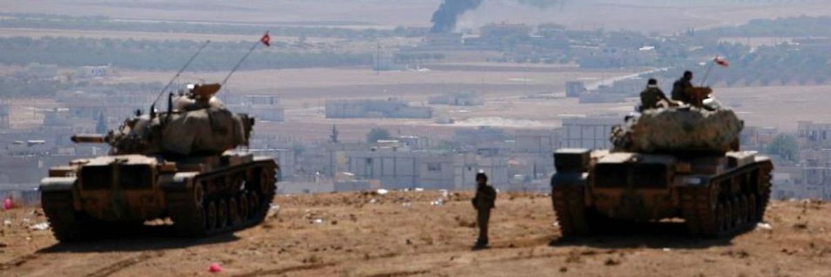 Smoke rises from the Syrian town of Kobani 