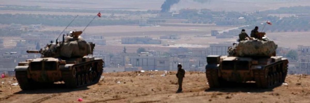 Smoke rises from the Syrian town of Kobani