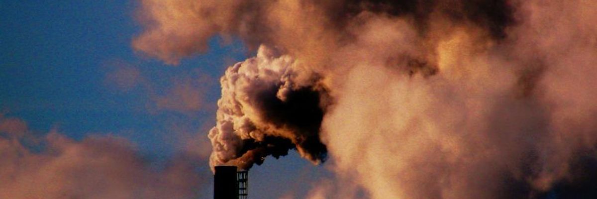 Smokestack bellows smoke