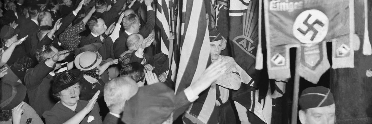 "Snapping into the regulation Nazi salute, " U.S. Bund members hail swastika at 1939 Madison Square Garden rally