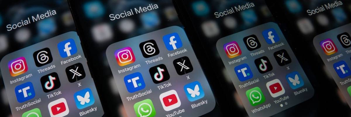 Social media app icons on smartphone, including Bluesky, Facebook, Youtube, and X.