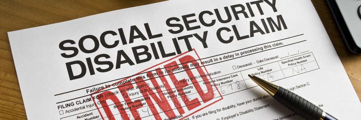 Social Security Claim Denied on a desk
