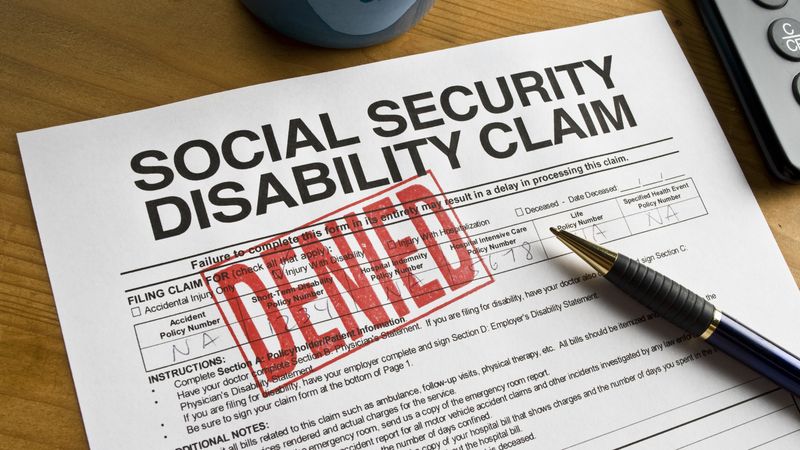 Social Security Claim Denied on a desk