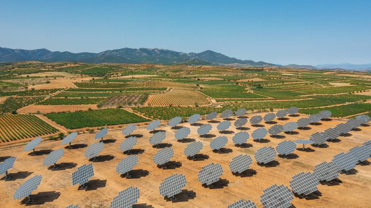 Solar panels are installed near vineyards in Spain.