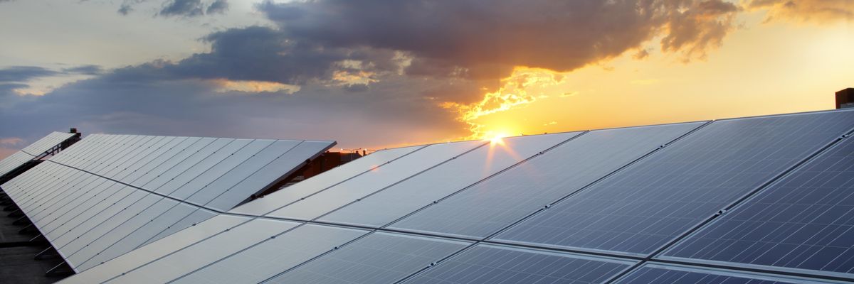 Solar panels are shown with the sun