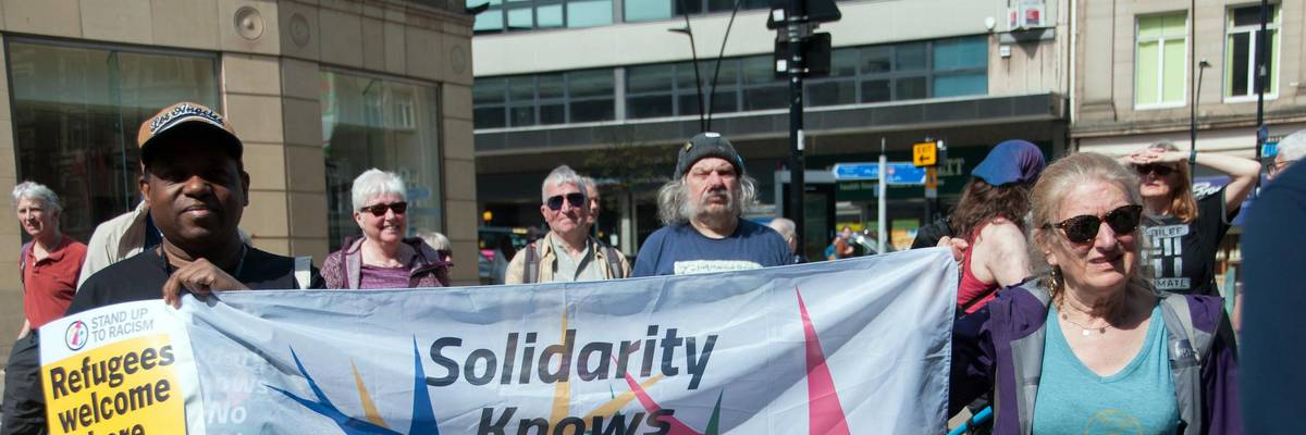 solidarity with Rwandan migrants