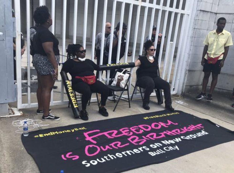 SONG leaders chained themselves to the Durham County Jail in North Carolina on May 9. (Twitter/@bear_peretz)