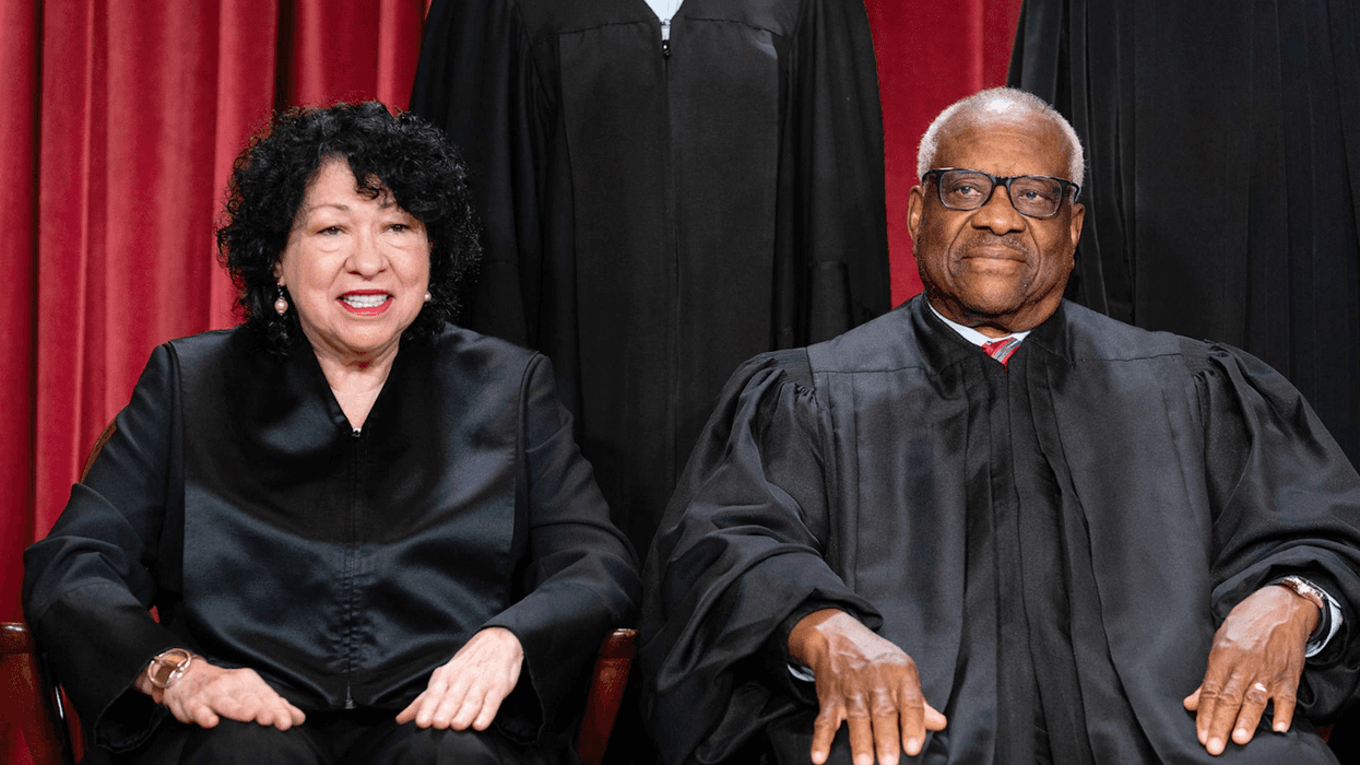 Sonia Sotomayor sits next to Clarence Thomas for a Supreme Court photo shoot
