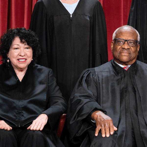Sonia Sotomayor sits next to Clarence Thomas for a Supreme Court photo shoot