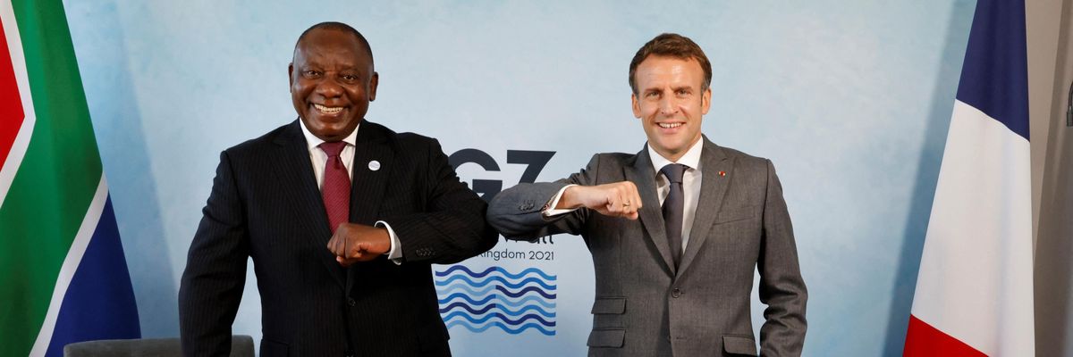 South Africa's President Cyril Ramaphosa (L) greets France's President Emmanuel Macron before a bilateral meeting during the G7 summit in Carbis Bay, Cornwall on June 12, 2021. (Phot: Ludovic Marin/AFP via Getty Images)