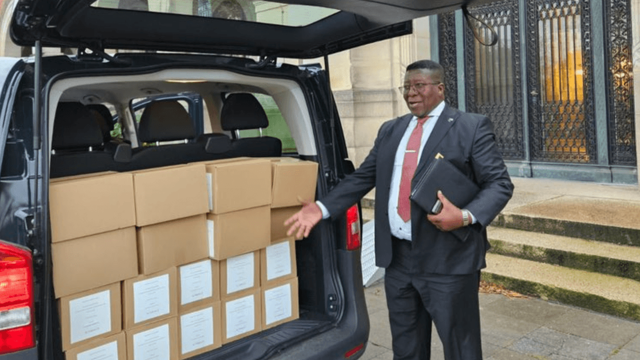 South African Ambassador to the Netherlands Vusi Madonsela delivers boxes of evidence in Israel's ICJ genocide trial