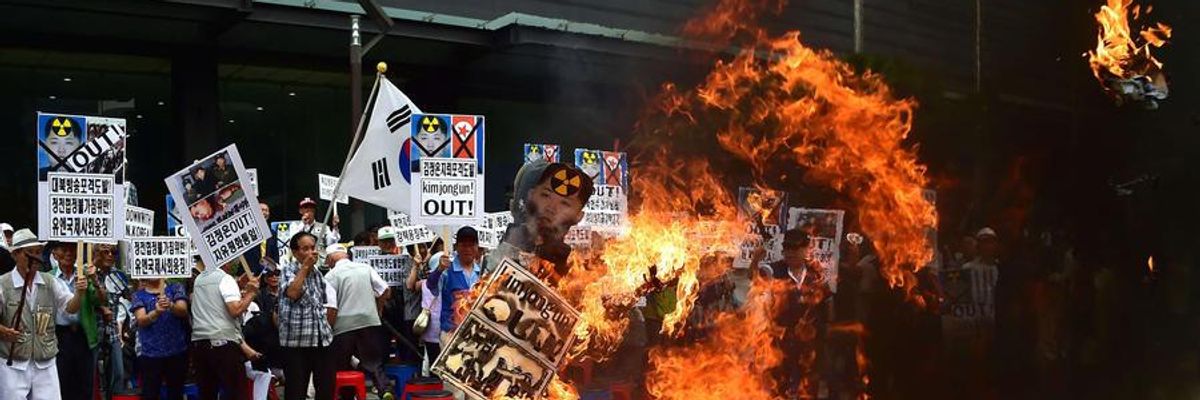South Korean activists burn an effigy of North Korean leader Kim Jong Un at a rally in Seoul