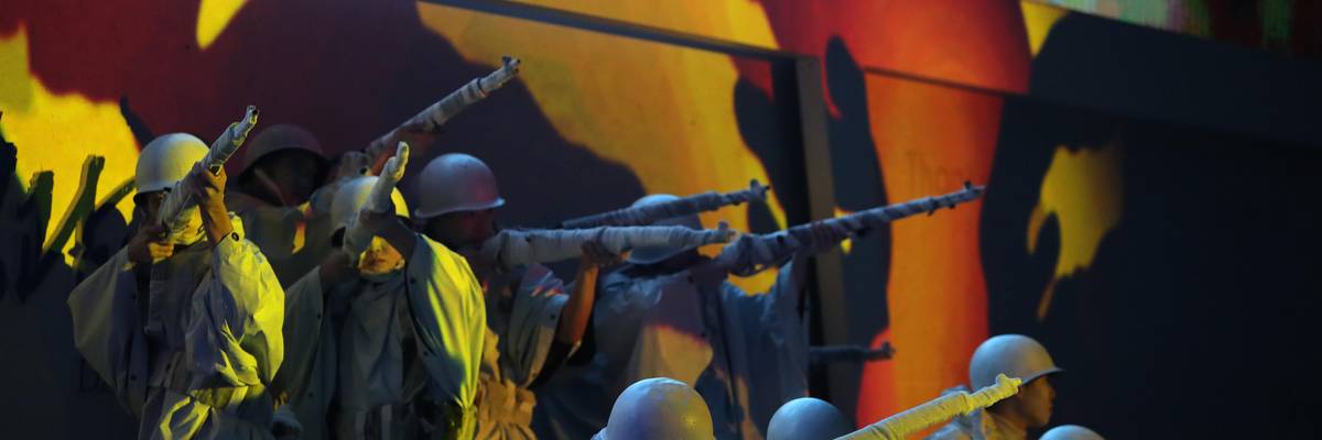 South Koreans perform during a ceremony