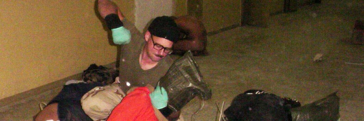 Spc. Charles Graner beats Abu Ghraib detainees