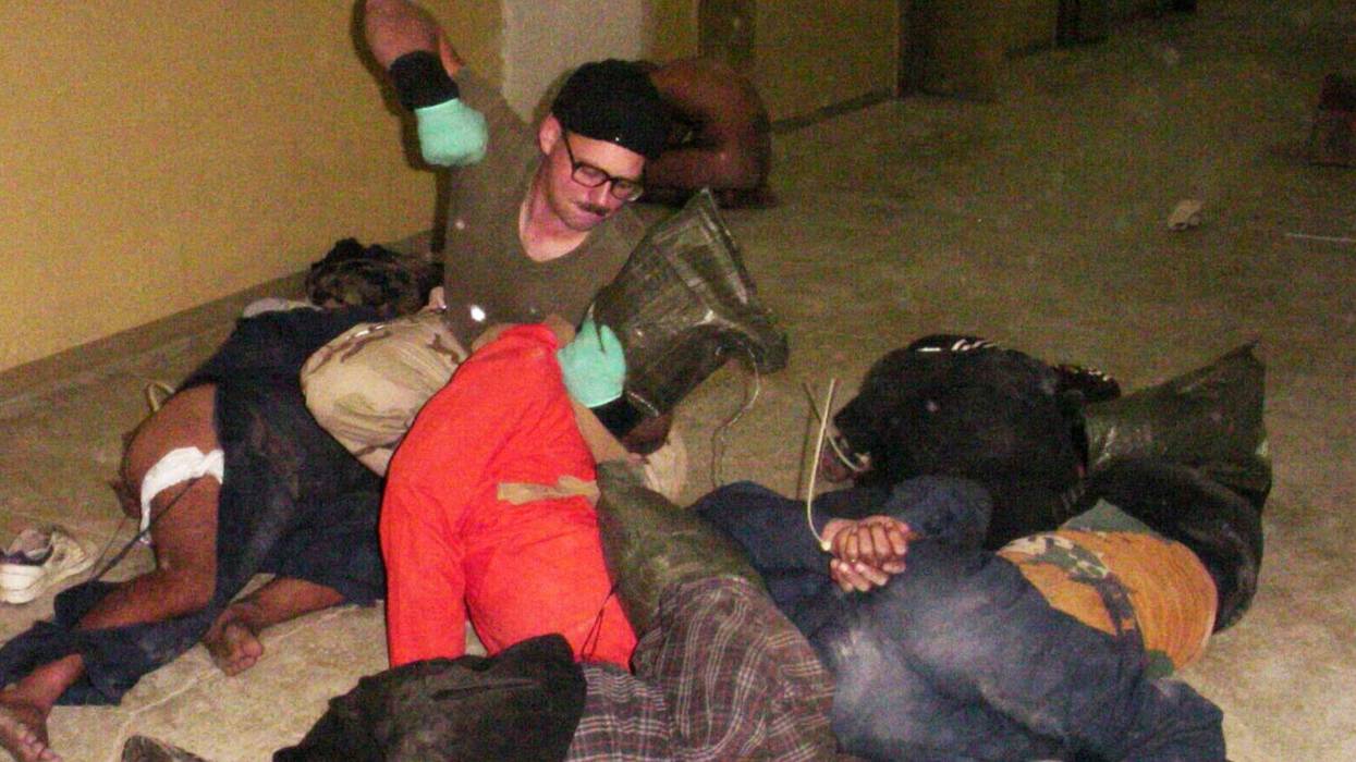 Spc. Charles Graner beats Abu Ghraib detainees