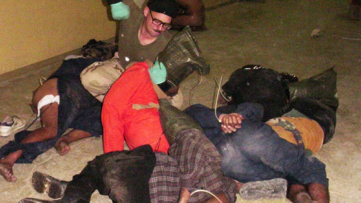 Spc. Charles Graner beats Abu Ghraib detainees