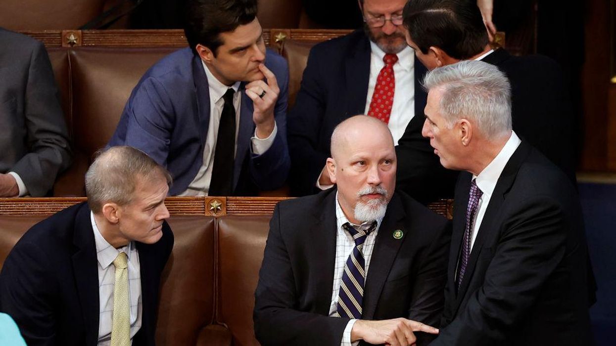 Speaker of the House Kevin McCarthy (R-CA) (R) talks to Reps. Chip Roy (R-TX) (C) and Jim Jordan (R-OH)