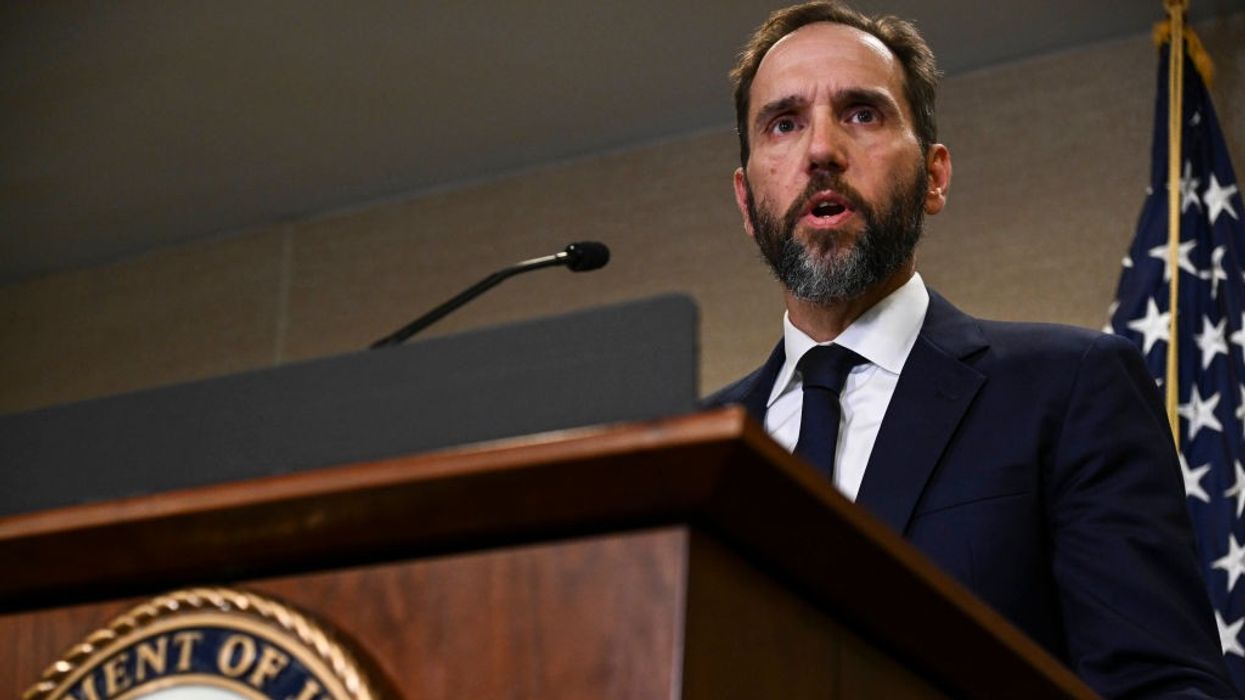 Special Counsel Jack Smith stands at a podium.