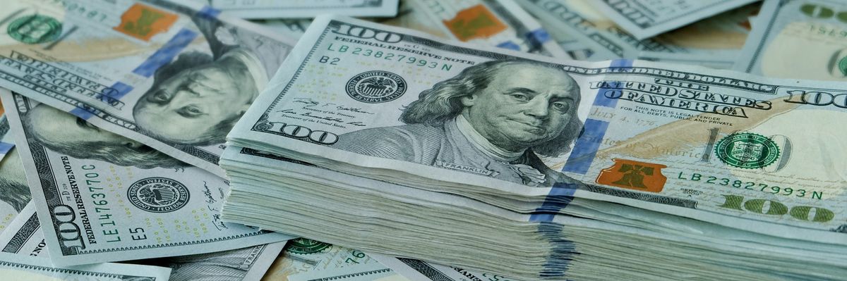 Stacking of US Dollar bank notes.