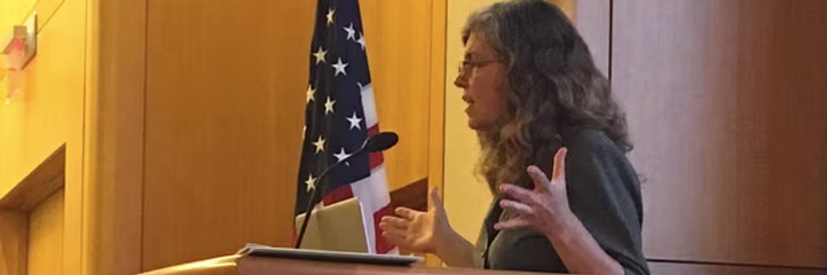 Stacy Gilbert at lectern