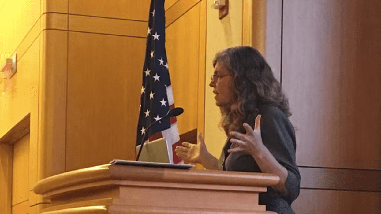 Stacy Gilbert at lectern
