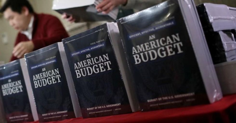 Staff members display recently released printed copies of U.S. President Donald Trump's fiscal year 2019 budget at the House Budget Committee on Capitol Hill February 12, 2018 in Washington, D.C. (Photo by Win McNamee/Getty Images)