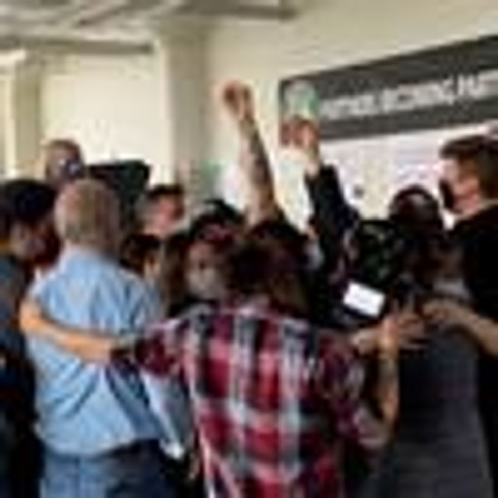 Starbucks employees celebrate after voting to unionize