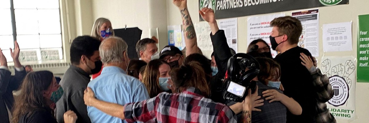 Starbucks employees celebrate after voting to unionize