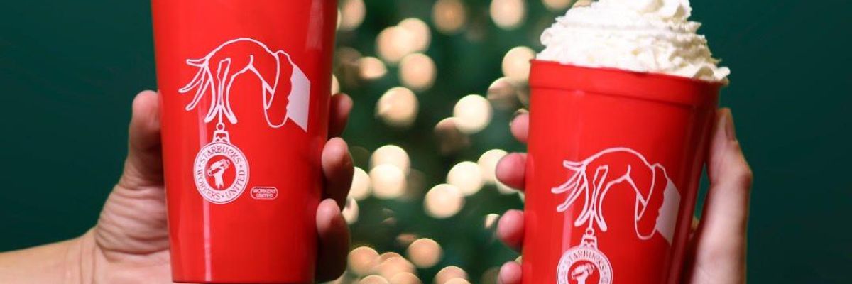 Starbucks workers hold union-branded cups
