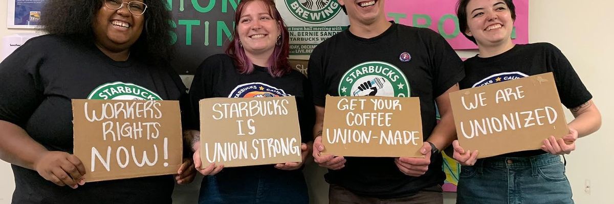 Starbucks workers in California hold pro-union signs