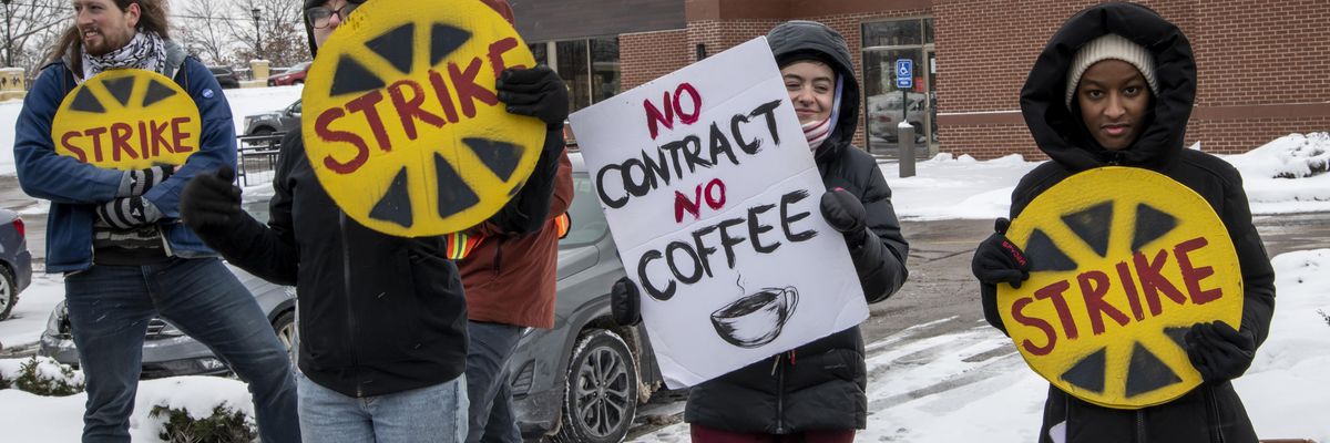 Starbucks workers protest the coffee giant's unfair labor practices and union-busting on December 17, 2022 in St. Anthony, Minnesota.