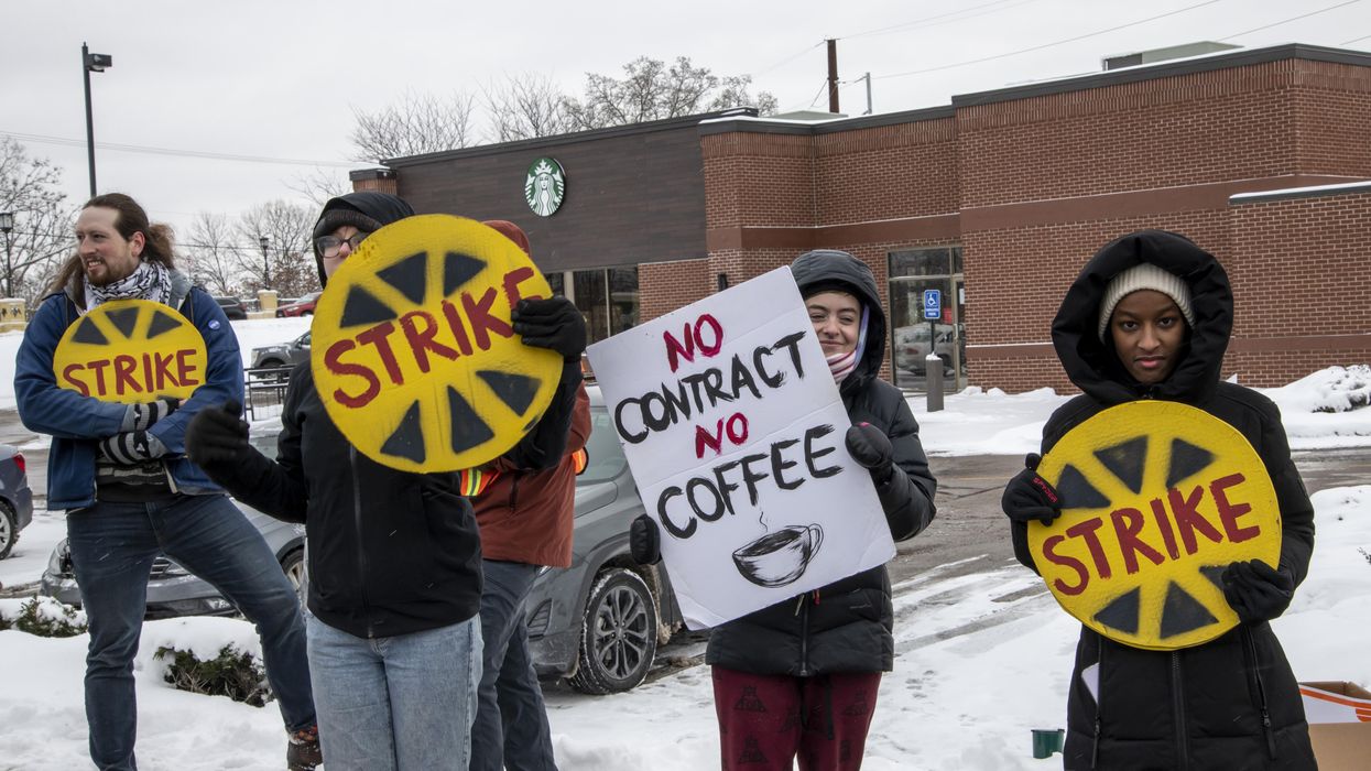 Starbucks workers protest the coffee giant's unfair labor practices and union-busting on December 17, 2022 in St. Anthony, Minnesota.